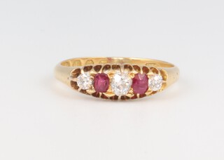 An Edwardian 18ct yellow gold 5 stone ring comprising 3 mine cut diamonds approx. 0.4ct and 2 rubies each 0.10ct, 2.9 grams, size O 