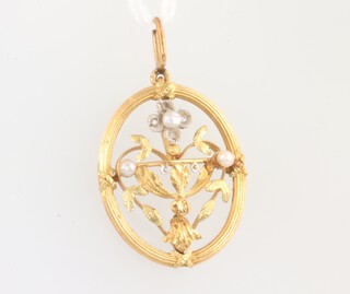 A yellow and white metal pierced pendant set with seed pearls and diamond chips 20mm, 1.3 grams 