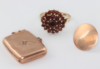 A 9ct yellow gold garnet cluster ring size M, a ditto stud and locket, gross weight 7.9 grams