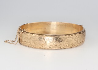 A 9ct yellow gold engraved hollow bangle 15.5 grams 