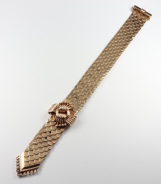 A stylish vintage 9ct yellow gold bracelet with fish scale decoration and open scroll mount, 54.9 grams 