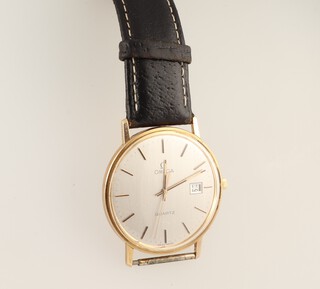 A gentleman's 9ct yellow gold Omega Quartz Calendar wristwatch contained in a 32mm case 