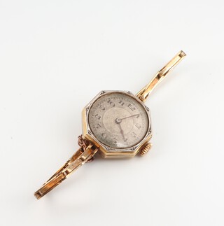 A lady's Art Deco 14ct octagonal wristwatch, contained in a 20mm case on a ditto expanding bracelet, gross weight including movement, glass and springs 16.2 grams 