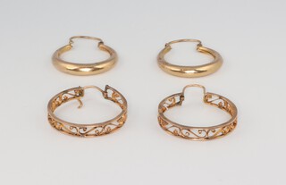 A pair of yellow metal 14k hoop earrings, 2.8 grams, a pair of yellow metal half hoop earrings 1.4 grams 