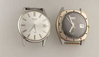 A 1960's vintage steel cased Seiko automatic calendar wrist watch with black dial 45mm and a later steel cased ditto 33mm