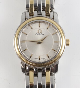 A lady's steel cased bi-metallic Omega wristwatch 20mm, on a ditto bracelet with original box and 2 spare links 