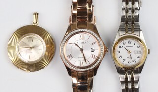 A lady's steel 2 colour metal Seiko calendar day date solar wristwatch, a lady's Citizen Ecodrive calendar wristwatch both boxed and a gold plated pendant watch 