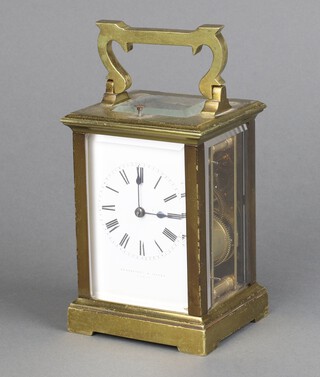 A French 19th/20th Century 8 day carriage timepiece, the 6cm enamelled dial with Roman numerals, Batty and Son Paris, contained in a gilt metal case, complete with key, 12cm x 9cm x 7cm 