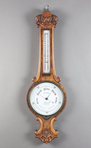 Bottomley of 11 Billiter Street London, an aneroid wheel barometer and thermometer contained in a carved walnut case with porcelain dial 81cm x 25cm 