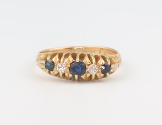 An 18ct yellow gold sapphire and diamond ring, the 3 sapphires approx. 0.16ct, the 2 diamonds each 0.03ct, 3.5 grams, size L 