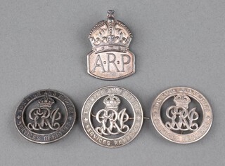 New Zealand, a First World War discharge badge marked NZ17982, 2 other discharge badges marked RN15831 and 185142 together with a silver ARP lapel badge 