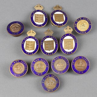 Seven First World War blue enamelled On War Service 1914 badges together with 5 ditto 1915 (1 a/f)