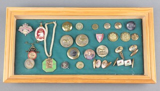 A 1948 Brighton Greyhound Stadium Club Member's badge, a 1952 Sandown Park racecourse badge, a 1931 Linfield Park racecourse badge together with various hunt buttons and cufflinks, framed 