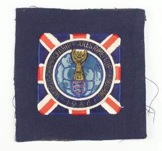 A gilt-thread embroidered cloth blazer badge inscribed World Championship, Jules Rimet Cup, England, 1966 15cm x 16cm,