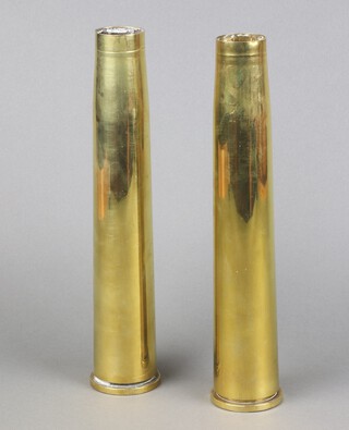 Two 40mm brass anti aircraft shells, the base marked Lot 141 40mm Mk 