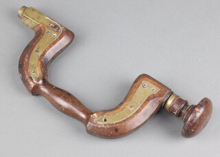 A 19th Century beech and brass carpenters brace (2 screws missing) 