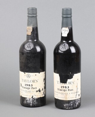 Two bottles of Taylors 1983 vintage port (1 label damaged) 