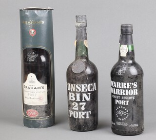 A bottle of Graham's 1994 late bottled vintage port and Warre's Warrior port and a bottle of Fonseca Bin 27 port 