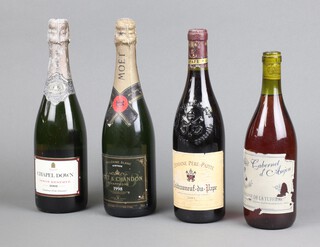 A bottle of 1998 Moet and Chandon champagne, a bottle of 2003 Domaine Pere-Papite Chateauneuf du Pape, a bottle of Cabernet de Anjou together with a bottle of 2001 Chapel Down Pinot Reserve 