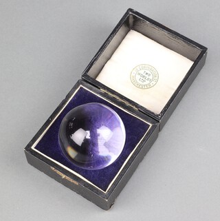 A late 19th Century Two Worlds Limited crystal ball, contained in a plush case 6cm diam. 