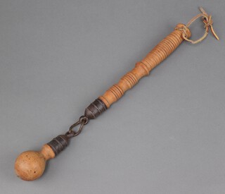 A 19th Century turned wooden and metal flail 