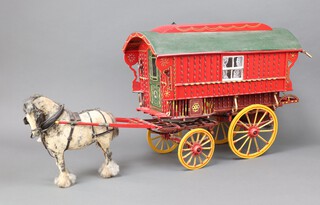 Jeffrey Knight, a scratch built model of a Romany caravan, the interior fitted a chest of drawers and stove, together with various fittings, steps and horse 40cm h x 53cm w x 28cm d 