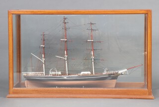 An impressive hand build wooden model of a 3 masted sailing ship contained in a mahogany case 79cm h x 231cm l x 47cm w