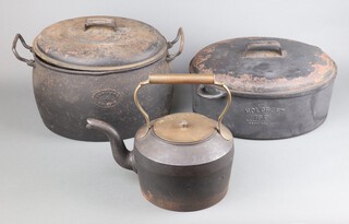 A Holcroft 18 pint oval iron fish kettle 14cm x 38cm x 28cm (some paint loss to the lid), a Clark & Co 4 gallon Aga pot with lid 22cm x 44cm x 28cm, a Cannon Deepfields no.4 1/2 6 pint cast iron kettle with brass lid and handle 30cm x 35cm x 19cm 