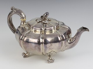 A Victorian silver melon shaped teapot with acorn finial on scroll feet with engraved armorial, London 1840, maker John Mortimer and John Samuel Hunt, 774 grams Ivory Exemption Certificate JPGCCZQ7