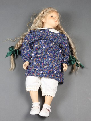 Steiff, a bisque headed doll, the head marked AR M Steiff 93-2 55/300, having a leather torso, upper arms and thighs, bisque forearms and calves and long blonde plaited hair, 57cm 