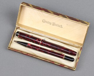 A Conway Stewart 759 red marbled fountain pen together with a ditto Nippy propelling pencil boxed 