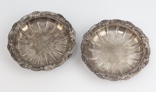 A pair of Edwardian cast silver dishes with scroll rims and feet, London 1905, 13cm, 433 grams, maker Lionel Alfred Crichton 