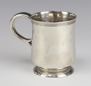 A Georgian style baluster mug with C scroll handle London 1949, 9.5 cm, 249 grams 