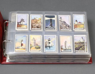 Wills overseas cigarette cards, a binder of 1920's and later complete sets to include Light Houses (original art work incomplete), Light Houses, Motor Cars, Merchant Ships of The World, Motor Cars, Motor Cycles, New Zealand Race Horses, New Zealand Butterflies, Moths and Beetles, Products of the World, Railway Engines, Riders of The World, Romance of The Heavens, Ships Badges, V.C's and War Ships