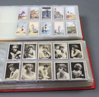 British American Tobacco Cigarette Cards, 2 binders of complete and partial sets to include Light Houses, London Ceremonials, British Butterflies, Life in The Tree Tops, Warriors of All Nations, Pre-Historic Animals, International Air Liners, Speed, Engineering Wonders, The Romance of The Heavens, Keep Fit, Do You Know, Flags of The Empire, Railway Working, Worlds Products, Etchings of Dogs, Series of Beauties (3 series), Siamese Drum Horses, Zoo Series, War Incidents, Nature Studies, Favourite Flowers, Man Made Natural Wonders of The World, Homeland Events, Beautiful England, Aeroplanes of Today, Wonders of The Sea 