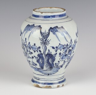 An 18th Century blue and white Delft baluster vase decorated stylised trees and flowers 15cm 