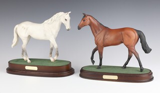 Royal Doulton, a figure of Desert Orchid, raised on an oval base 22cm h x 24cm w x 10cm d and 1 other Red Rum 22cm h x 24cm 