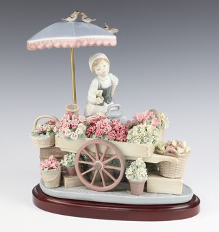 A Lladro figure "The Flowers Seller" base impressed 1454 G-1411 23cm 