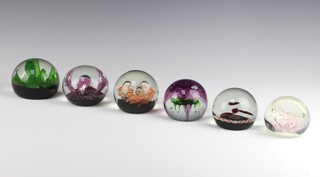 Four Caithness limited edition paperweights - Sundance 919/3000 1976, Sea Kelp 524/1500 1975, Sea Pearl 409/500 and Tropicana 495/500 1976, 1 other Autumn 151/500 1976 and 1 other paperweight etched a partridge dated 1979