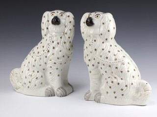 A pair of 19th Century Staffordshire figures of seated dogs 33cm (1 cracked) 