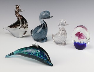 A green Wedgwood glass paperweight in the form of a dolphin 22cm, ditto duck 17cm (chip to base), 2 other paperweights in the form of ducks and an oval glass paperweight 