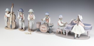 A Lladro 5 piece jazz band comprising pianist and singer, drummer (hands f), 2 double base players, saxophone, trumpet (trumpet f) all are seconds 