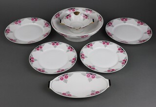 A 29 piece Limoges Art Deco dinner service comprising large tureen and cover (slight chip to 1 handle) small tureen and cover, 2 oval graduated twin handled meat plates (larger with chip to handle), 3 circular graduated twin handled platters, twin handled sauce boat, circular bowl, 2 sauce boat stands (1 chip to handle), 9 dinner plates (1 chipped to rim), 9 side plates 