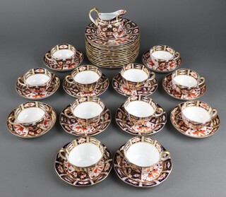 A 41 piece collection of various Royal Crown Derby  tea ware, varying dates, comprising 14 tea plates, 13 saucers (3 cracked, 1 chipped), 12 cups (2 cracked, 1 repaired), cream jug and a pin tray (a/f) 