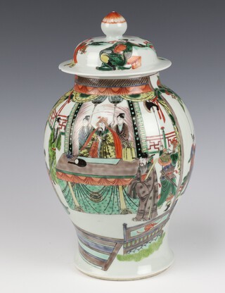 A 19th Century Chinese famille verte baluster vase and cover decorated with courtiers and attendants on a pavilion terrace 34cm 