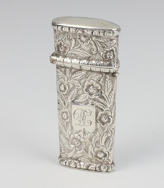 A William IV repousse silver etuis with scroll decoration and monogram, having  2 tortoise shell mounted knives, Birmingham 1833, 6.5cm 