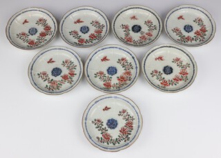 Eight 19th Century Chinese shallow dishes with white moulded decoration, over painted with butterflies amongst insects 17cm 