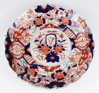 A late 19th Century Chinese Imari dish decorated with a basket of flowers 38cm 