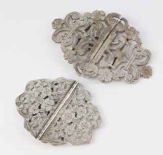 An Edwardian pierced and engraved silver buckle Birmingham 1908, a silver plated ditto