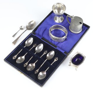 A set of 6 silver coffee spoons Birmingham 1911, an egg cup, bangle, salt and 2 spoons, 124 grams 